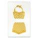 Yellow polka dot bikini set on a textured white paper